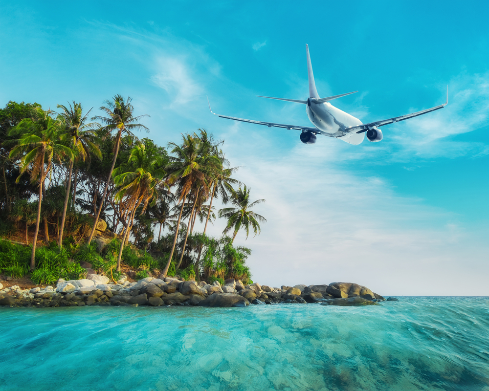 Airplane,Flying,Over,Amazing,Ocean,Landscape,With,Tropical,Island.,Thailand